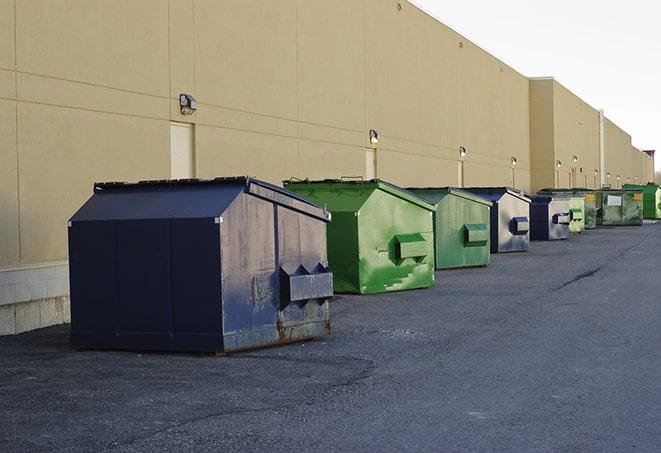 an assortment of sturdy and reliable waste containers near a construction area in Adams MN